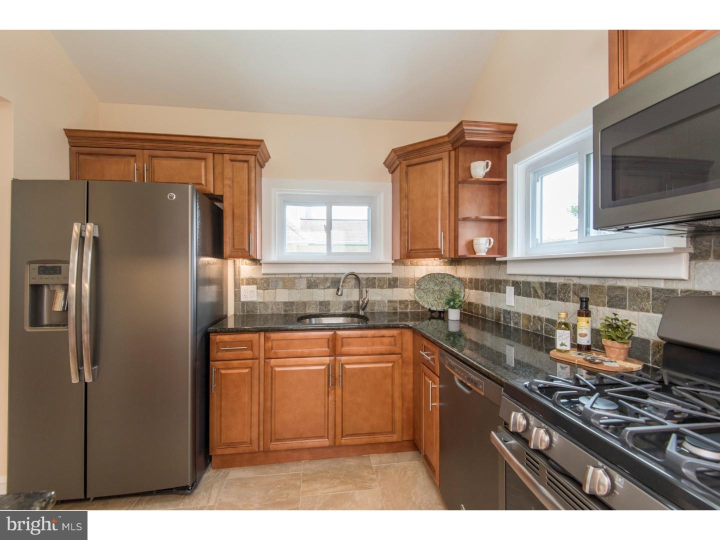 408 Lenox Road Havertown, PA 19083 - Photo 9 of 25 a kitchen with stainless steel appliances a sink stove and refrigerator