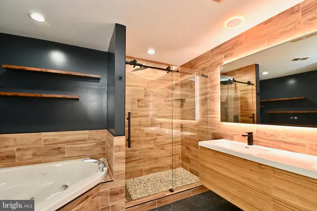 a bathroom with a tub and a sink