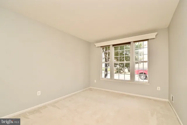 a spacious bathroom with a double vanity sink and mirror