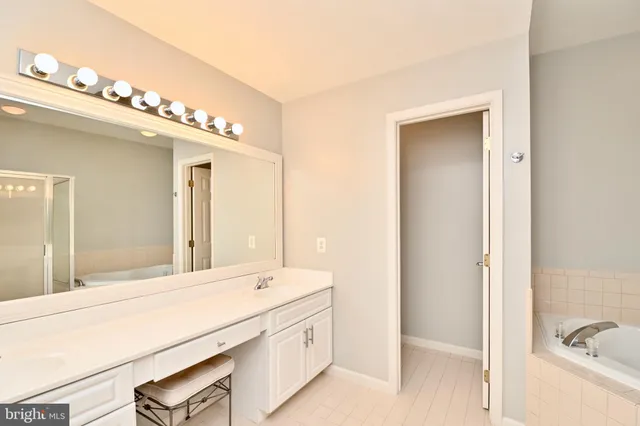 a bathroom with a tub and shower
