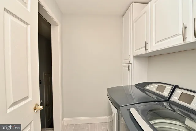 a view of a room with wooden walls and stairs