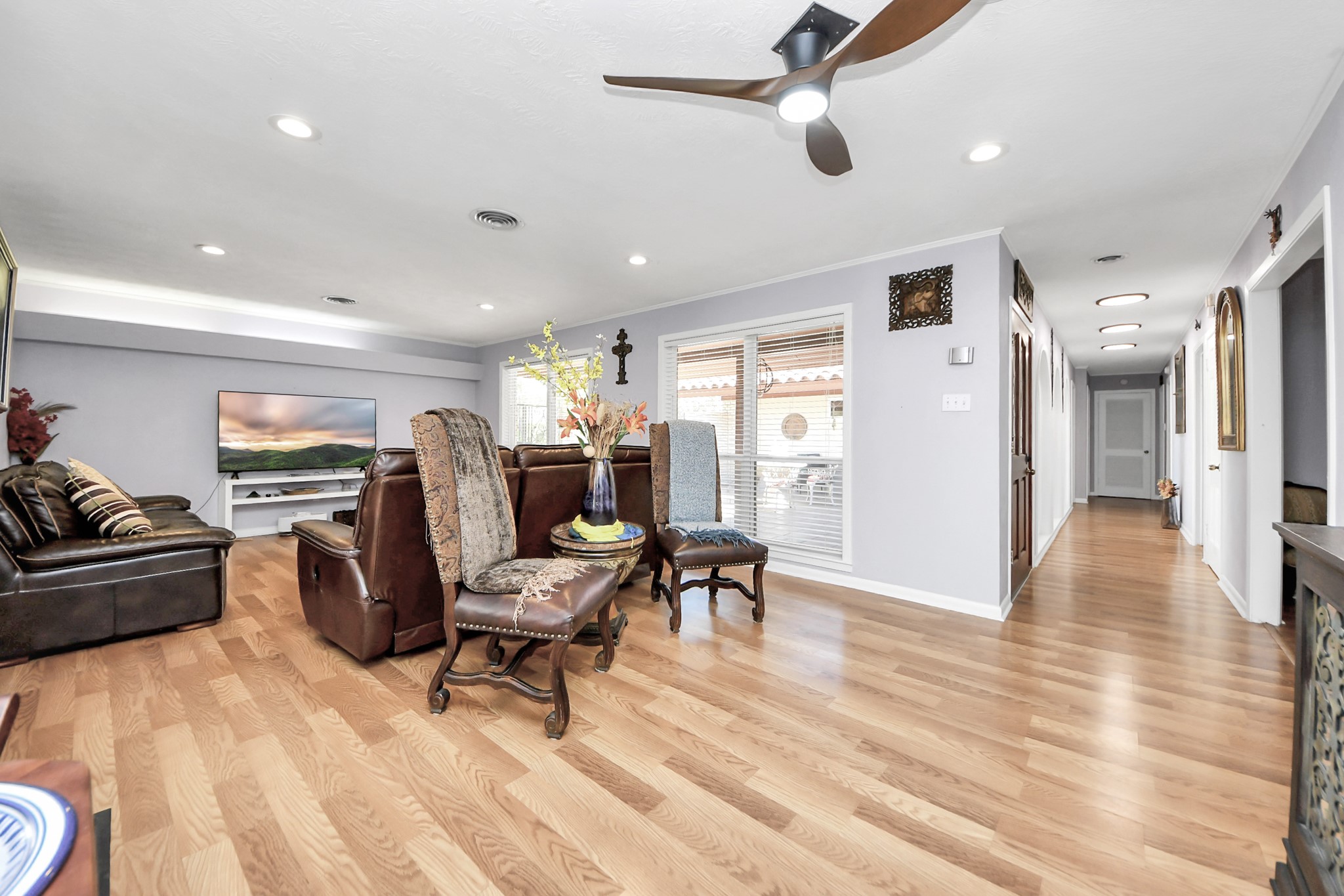 142 Wall Street Cleveland, TX 77327 - Photo 13 of 36 a living room with furniture and a chandelier