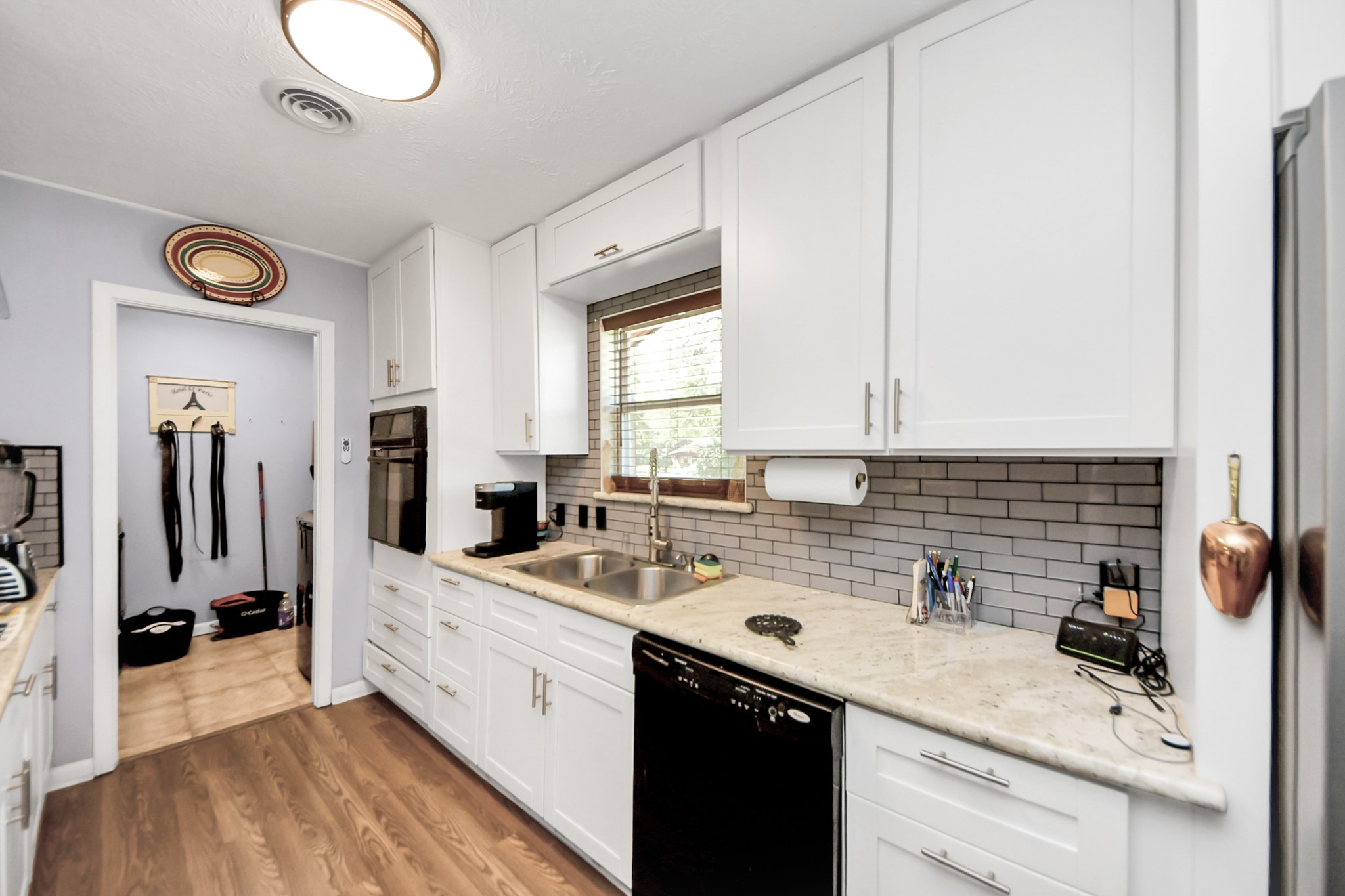142 Wall Street Cleveland, TX 77327 - Photo 16 of 36 a kitchen with a sink cabinets and window