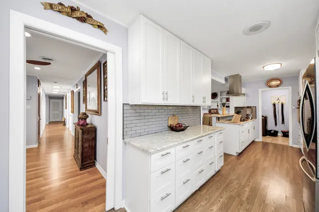 a view of a kitchen with appliances and cabinets