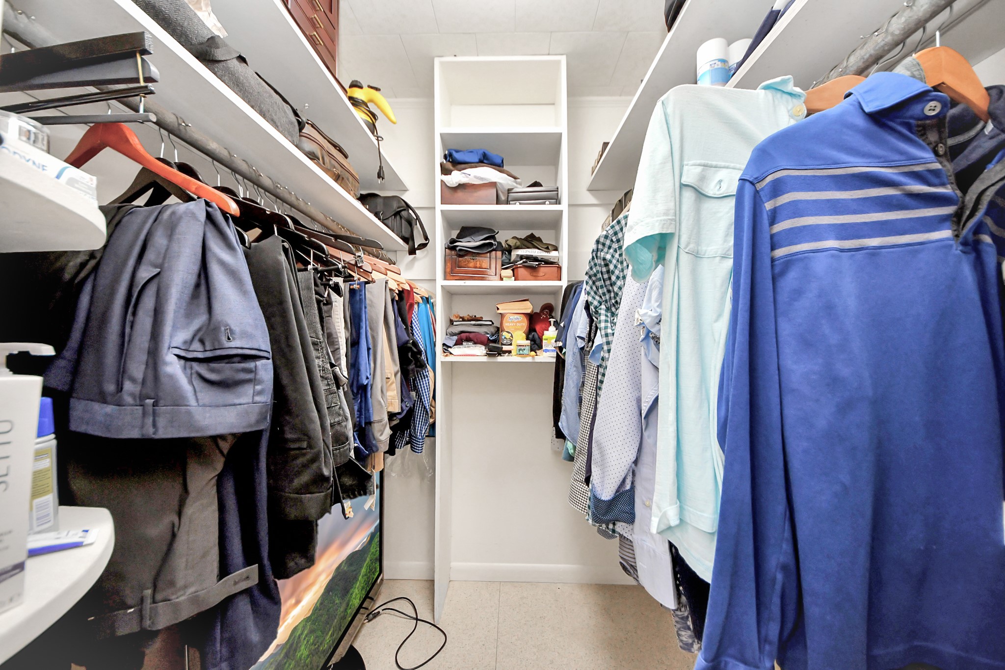 142 Wall Street Cleveland, TX 77327 - Photo 25 of 36 a view of walk in closet with clothes and shoes