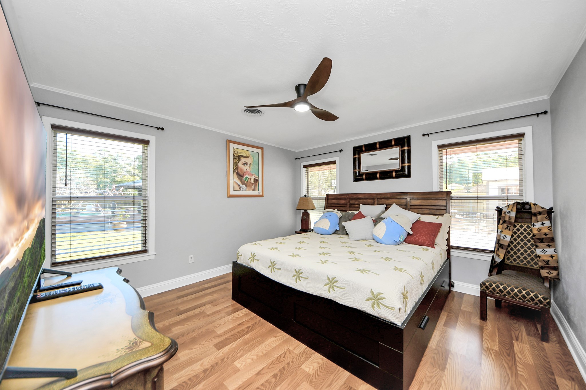 142 Wall Street Cleveland, TX 77327 - Photo 26 of 36 a bedroom with a bed and wooden floor