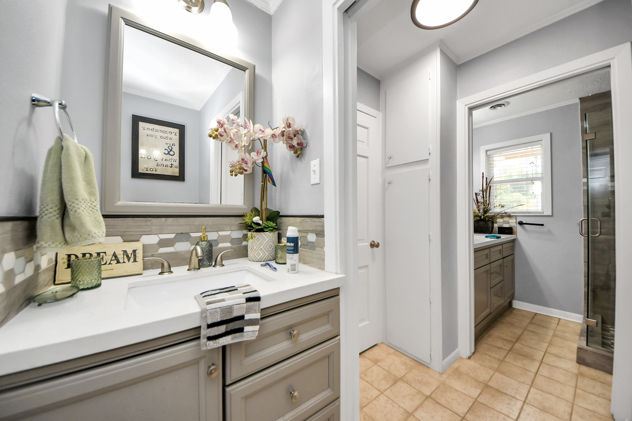 142 Wall Street Cleveland, TX 77327 - Photo 28 of 36 a bathroom with a sink and a mirror