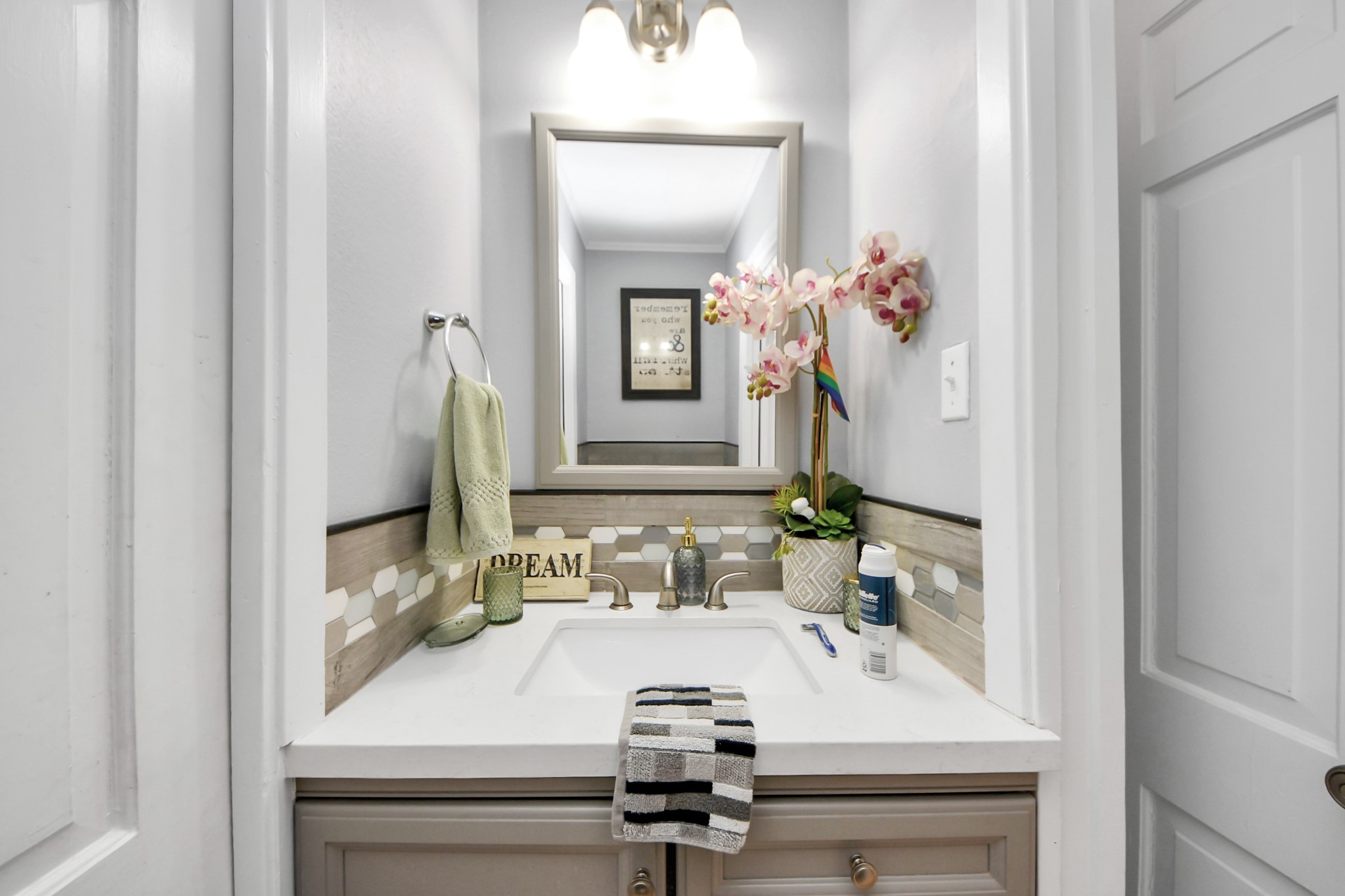 142 Wall Street Cleveland, TX 77327 - Photo 29 of 36 a bathroom with a sink and a mirror