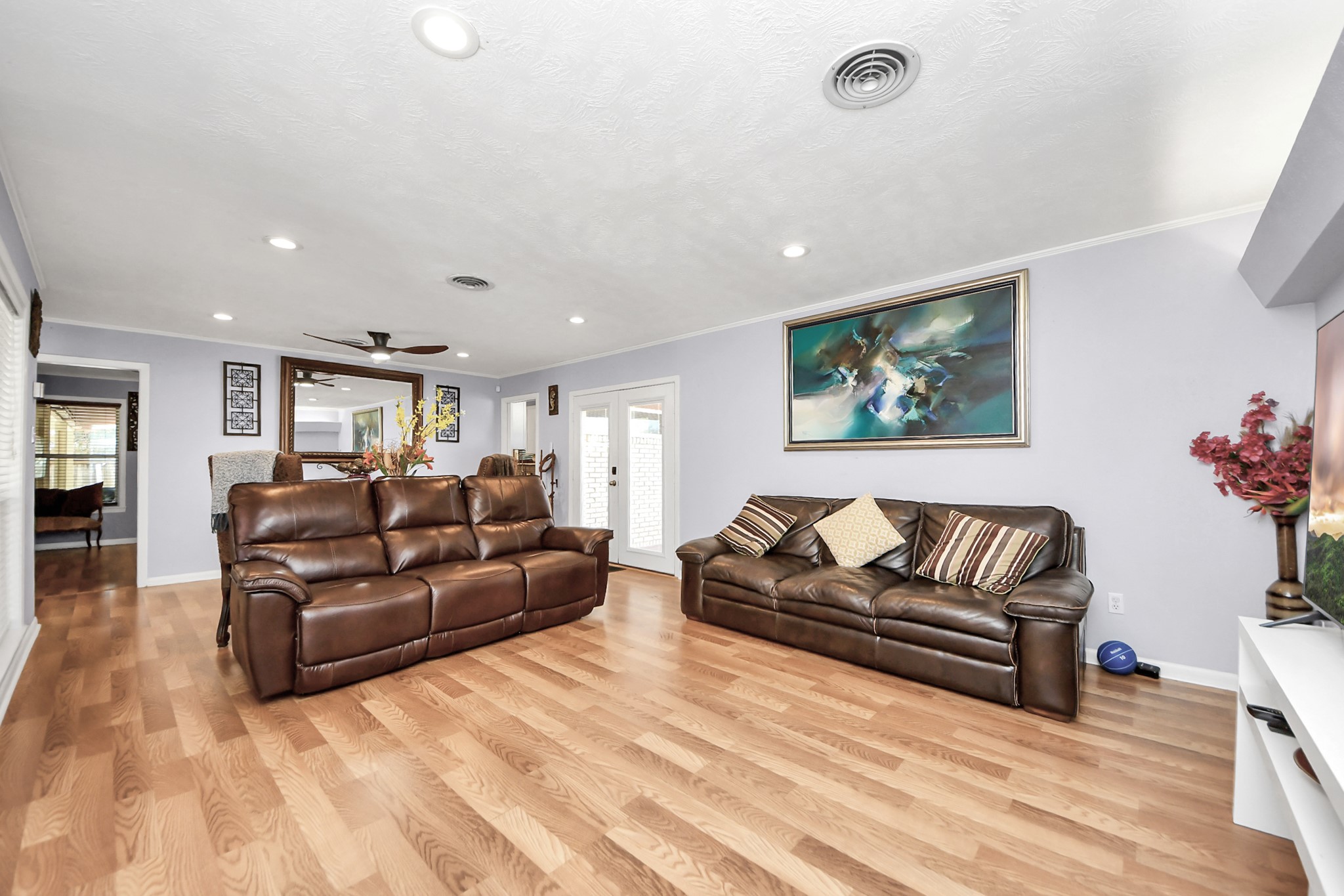 142 Wall Street Cleveland, TX 77327 - Photo 10 of 36 a living room with furniture or couch and a potted plant