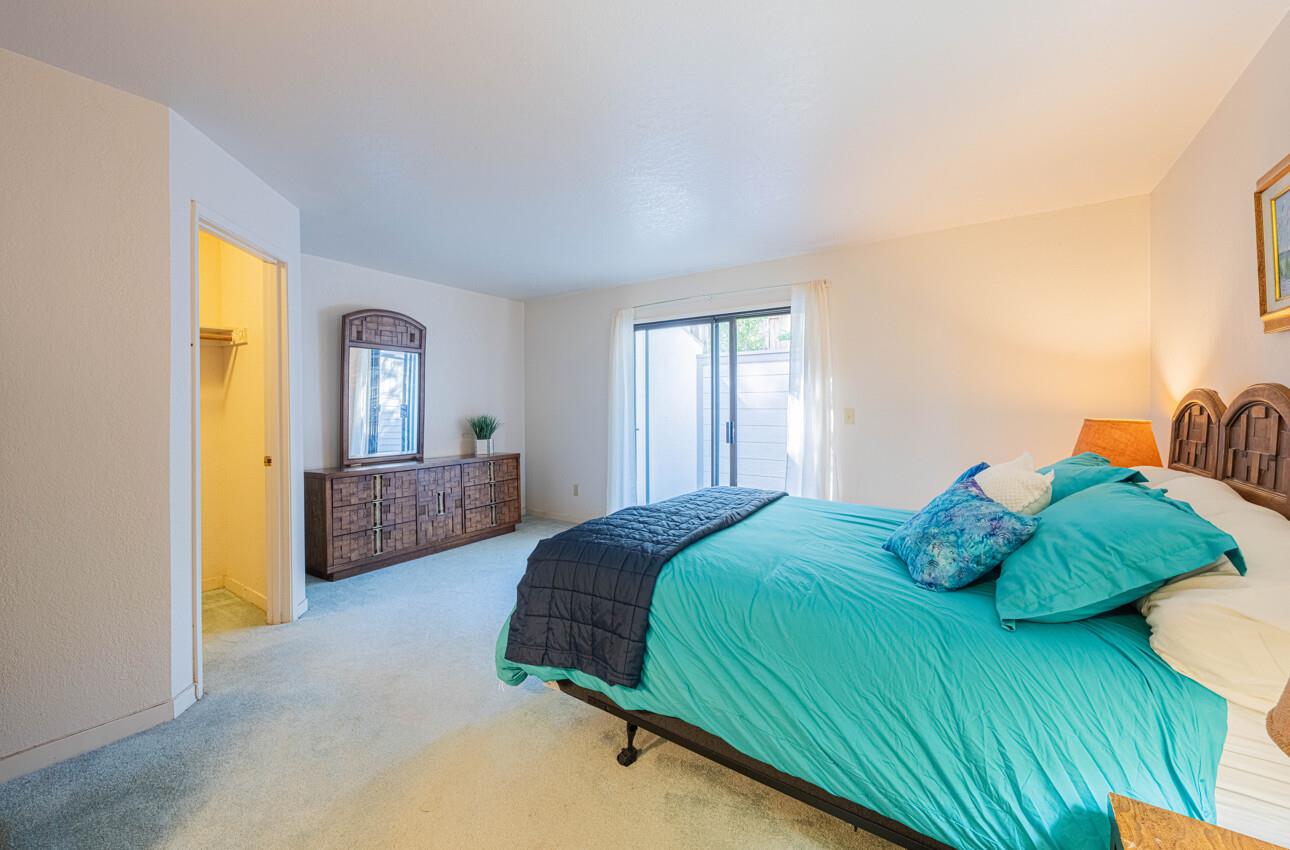 585 Hawthorne Street, Unit 103 Monterey, CA 93940 - Photo 17 of 30 a bedroom with a bed and window