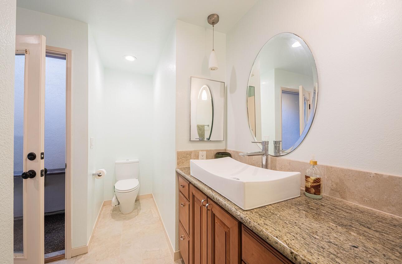 585 Hawthorne Street, Unit 103 Monterey, CA 93940 - Photo 21 of 30 a bathroom with a sink and a mirror