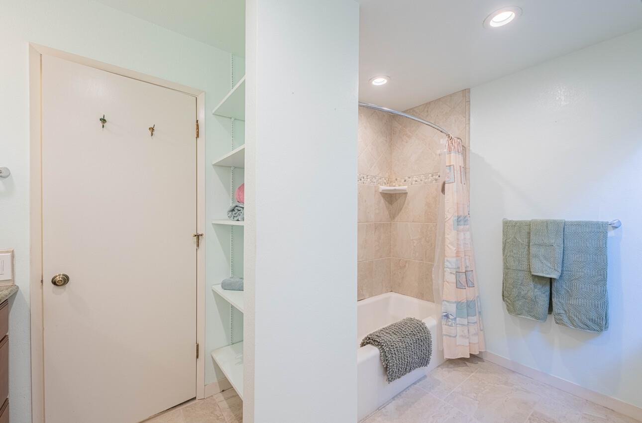 585 Hawthorne Street, Unit 103 Monterey, CA 93940 - Photo 22 of 30 a spacious bathroom with a shower and a sink