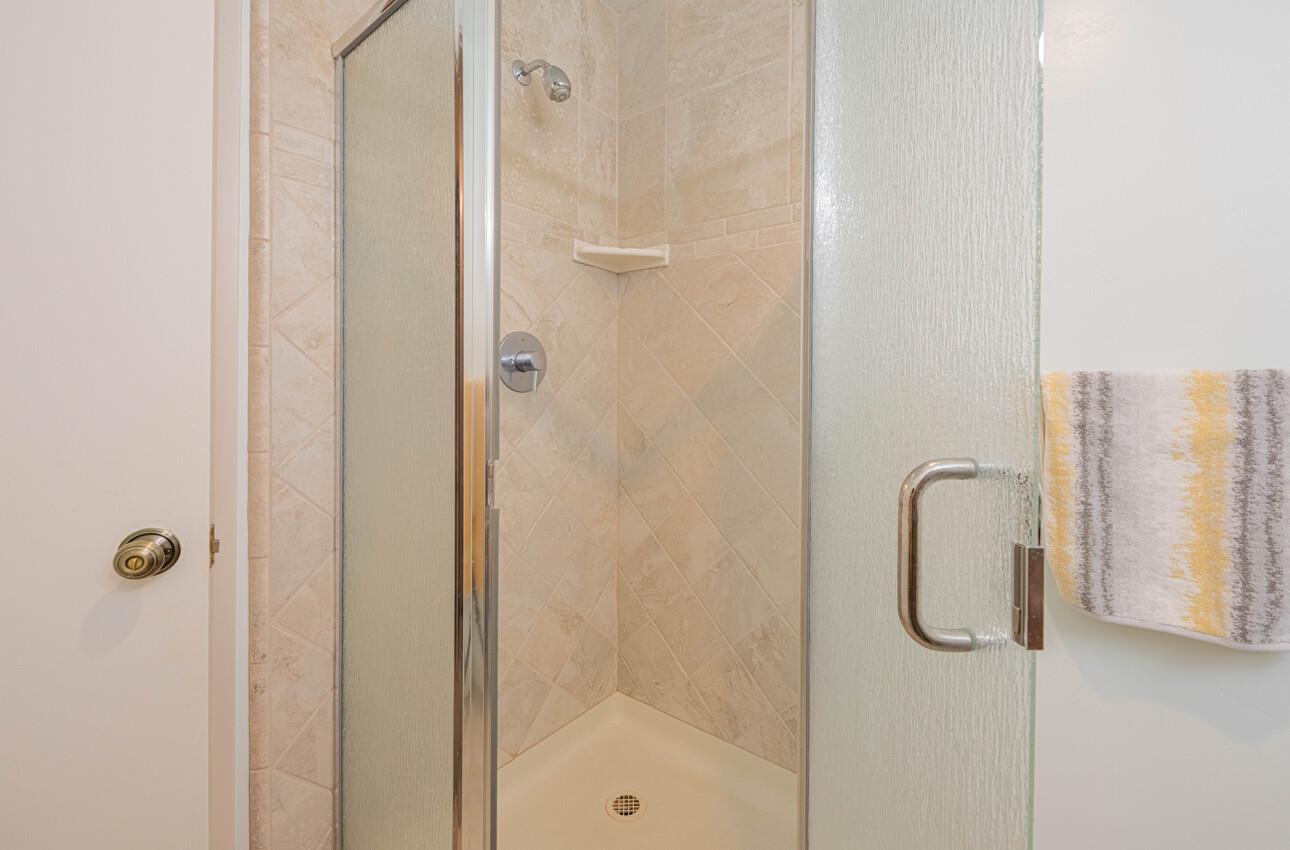 585 Hawthorne Street, Unit 103 Monterey, CA 93940 - Photo 29 of 30 a bathroom with a shower