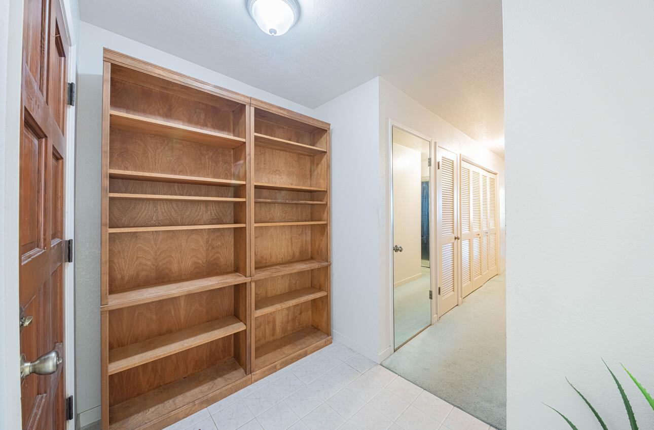 585 Hawthorne Street, Unit 103 Monterey, CA 93940 - Photo 7 of 30 a view of walk in closet with empty racks