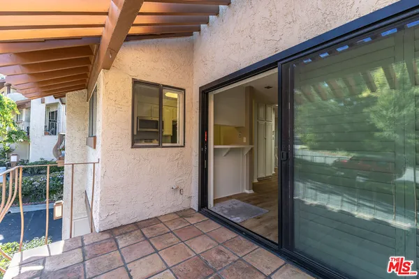 a view of a glass door with a balcony