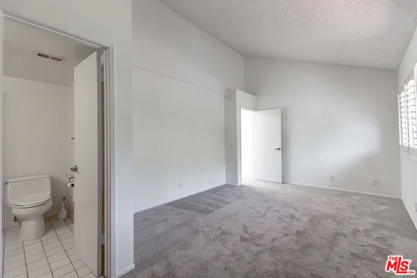 a view of a bathroom with a toilet