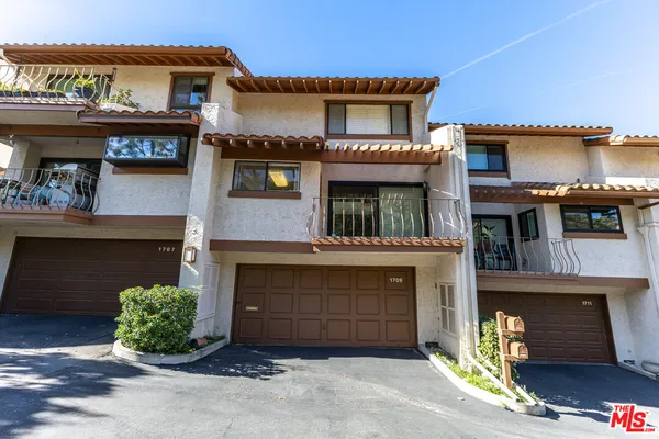 a front view of a building with a garage