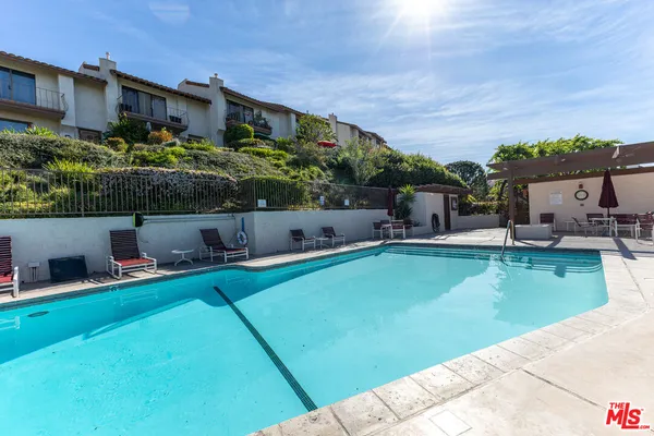 a backyard of a house with seating space