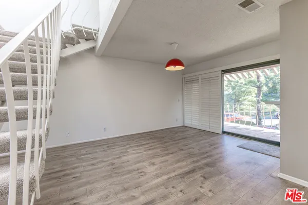 a view of livingroom and hardwood floor