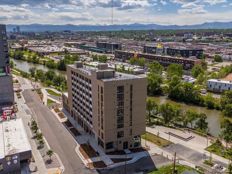 3575 Chestnut Place, Unit 301 Denver, CO 80216 - Photo 12 of 14 a view of a city with tall buildings