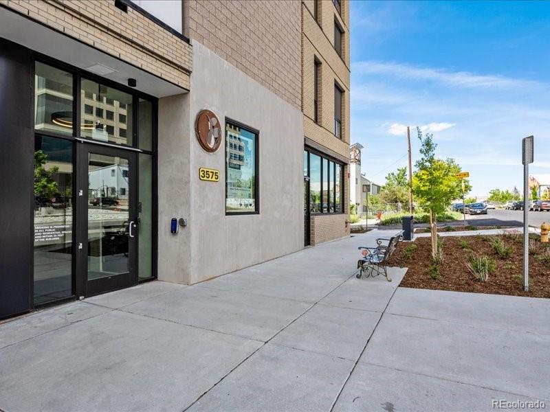 3575 Chestnut Place, Unit 301 Denver, CO 80216 - Photo 14 of 14 a view of a building with outdoor space