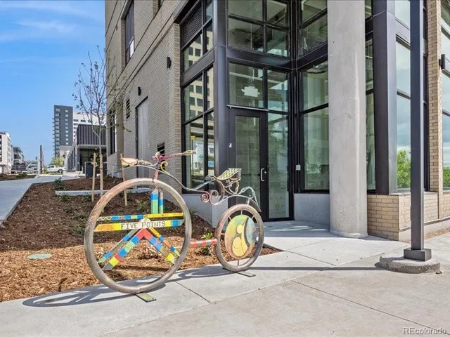a view of a brick building with floor to ceiling windows