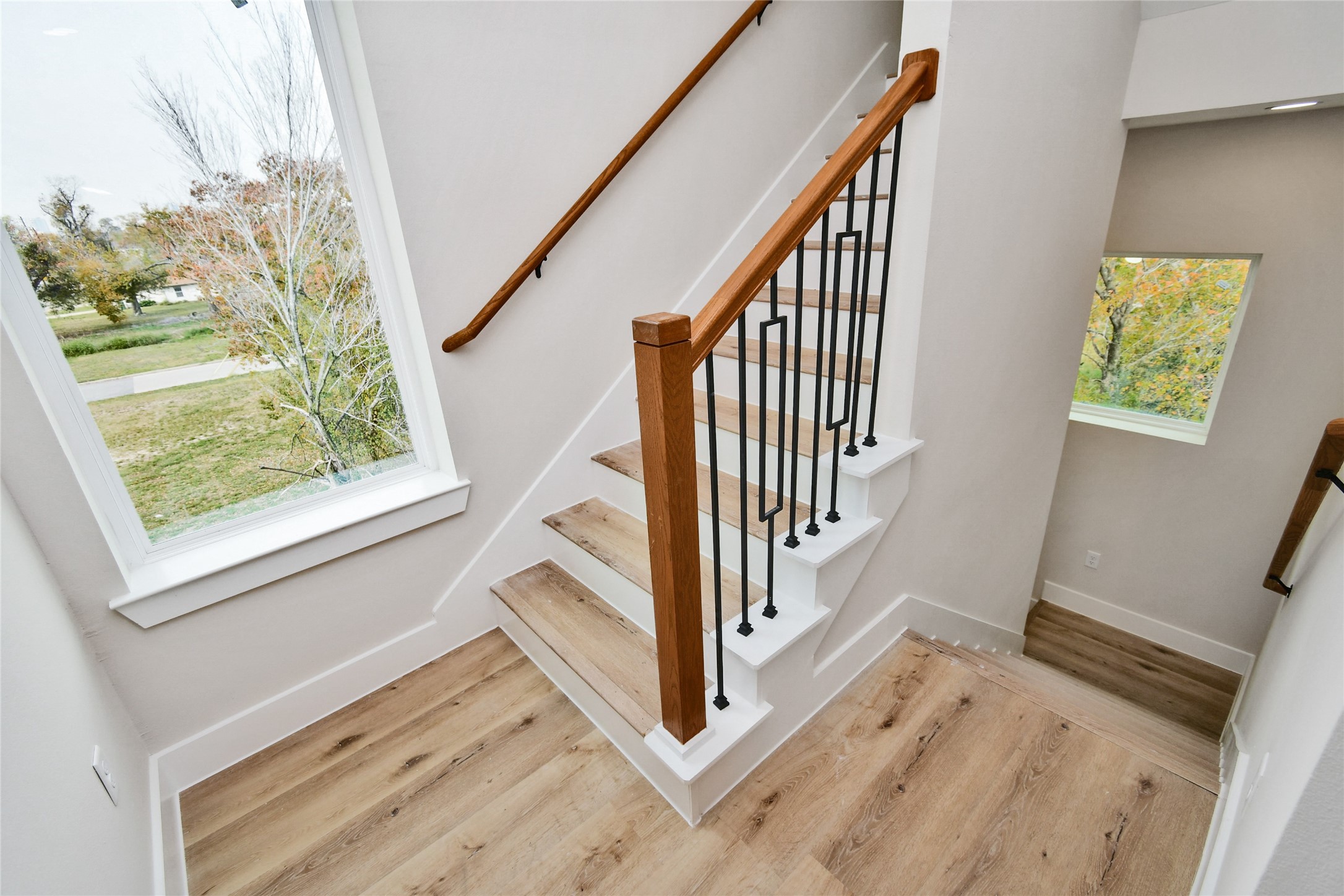 3229 Tuam Street Houston, TX 77004 - Photo 38 of 50 Stairs in the 3rd floor going up to the 4th floor. Large frame windows turn this house to a naturally decorated house.