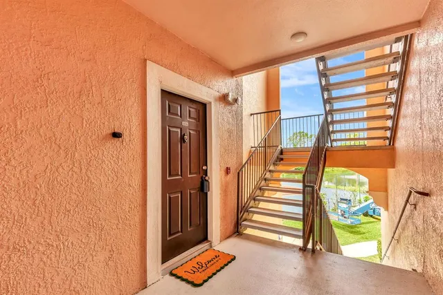 a kitchen with refrigerator cabinets and wooden floor