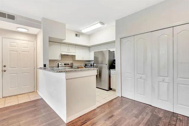 a view of kitchen with wooden floor