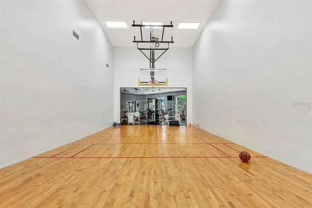 a room with gym equipment and a window