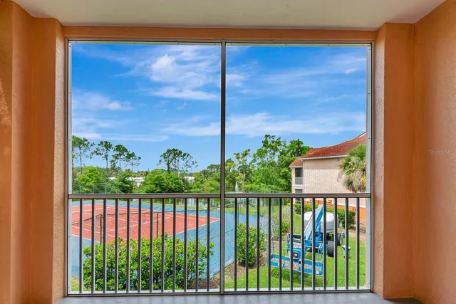 a kitchen with stainless steel appliances granite countertop a stove and white cabinets