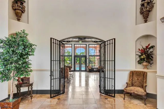 a view of a house with a yard and potted plants