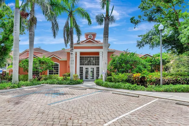 a view of a lake with a building in the background