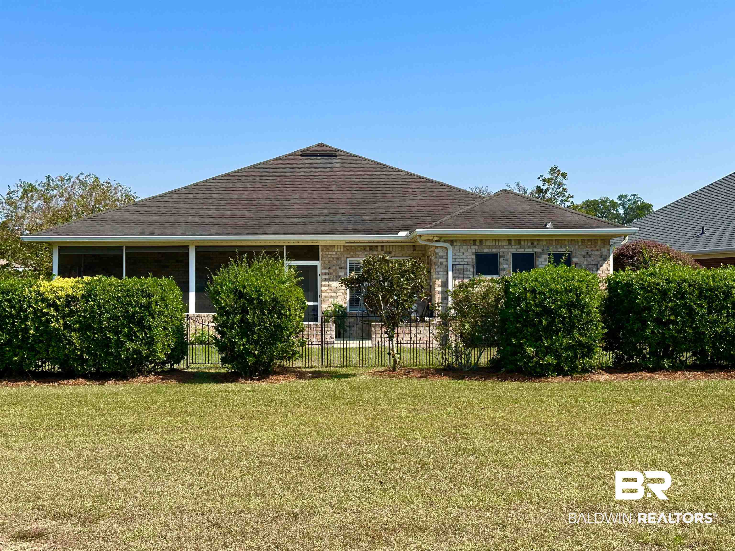 249 Hemingway Loop Foley, AL 36535 - Photo 26 of 33 Rear view of property with a lawn