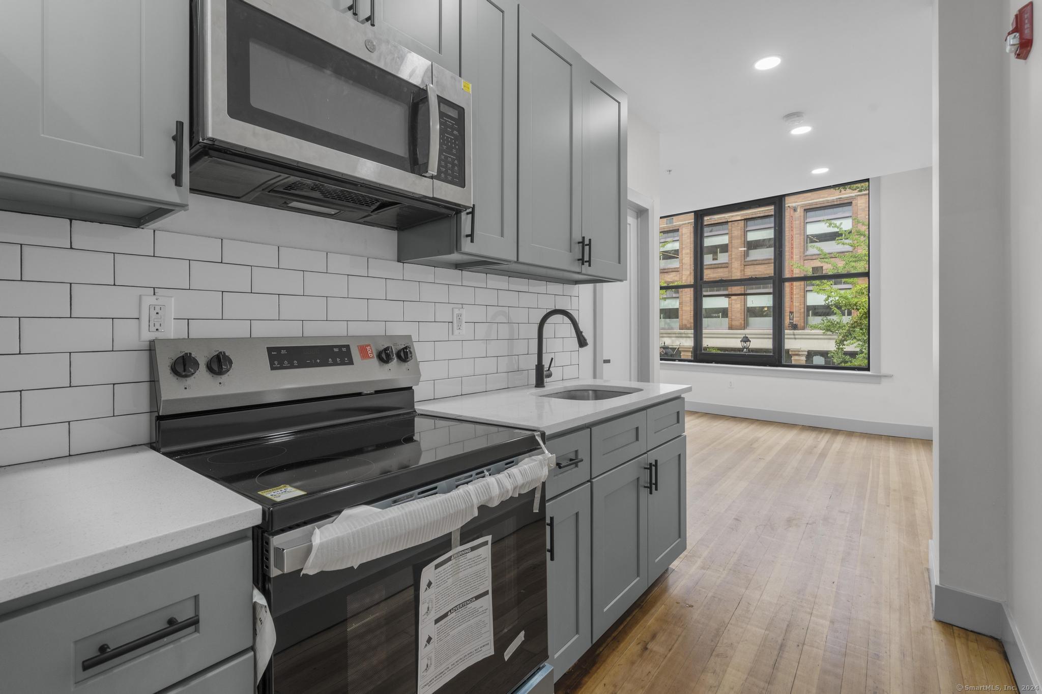 a kitchen with a stove and a microwave