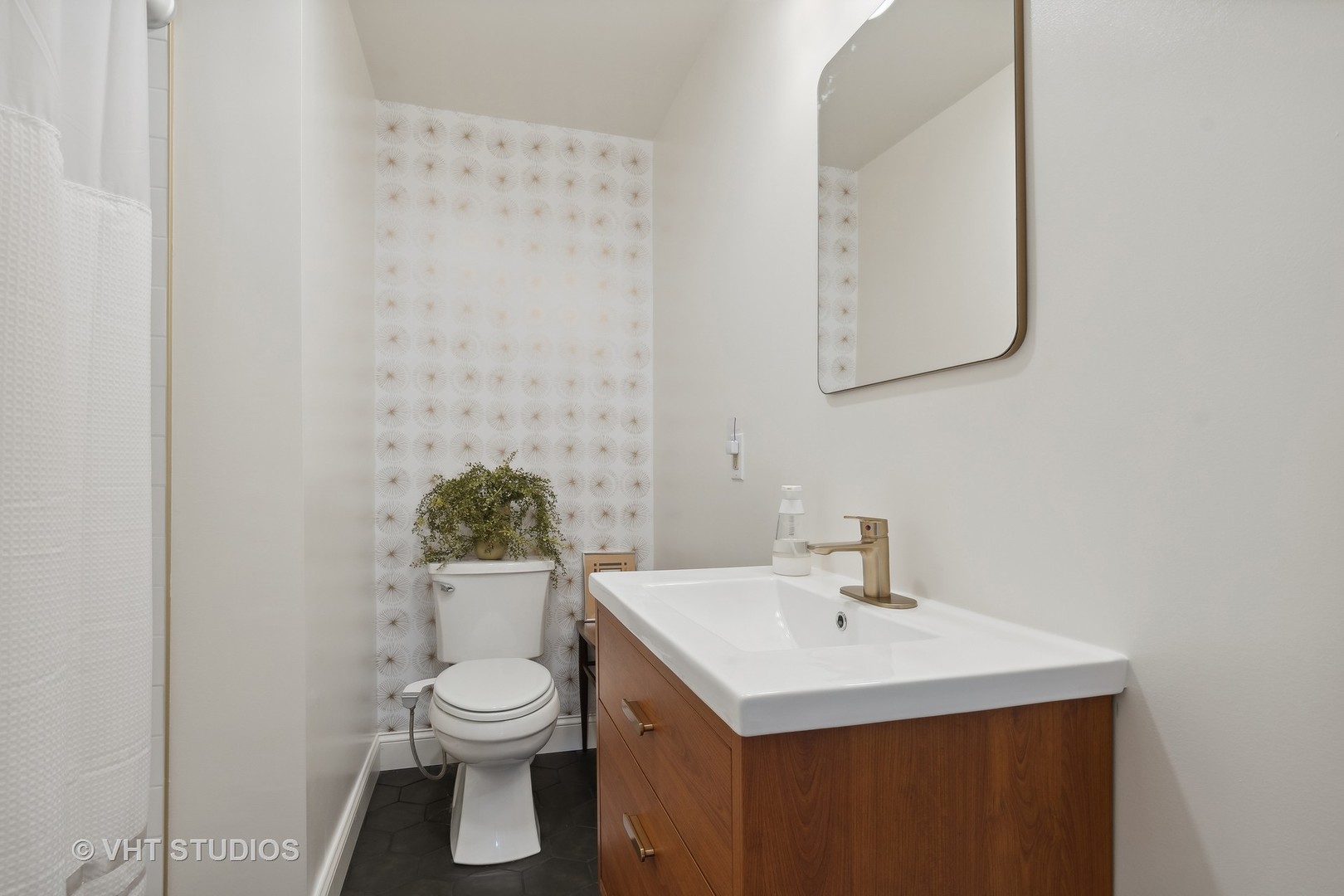 116 High Street Highwood, IL 60040 - Photo 7 of 18 a bathroom with a sink a toilet and mirror