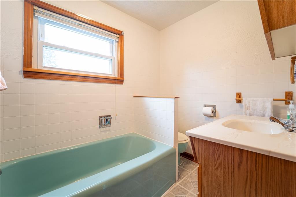 1590 New Stanton Ruffsdale Road Ruffs Dale, PA 15679 - Photo 8 of 16 a bathroom with a sink and a bathtub