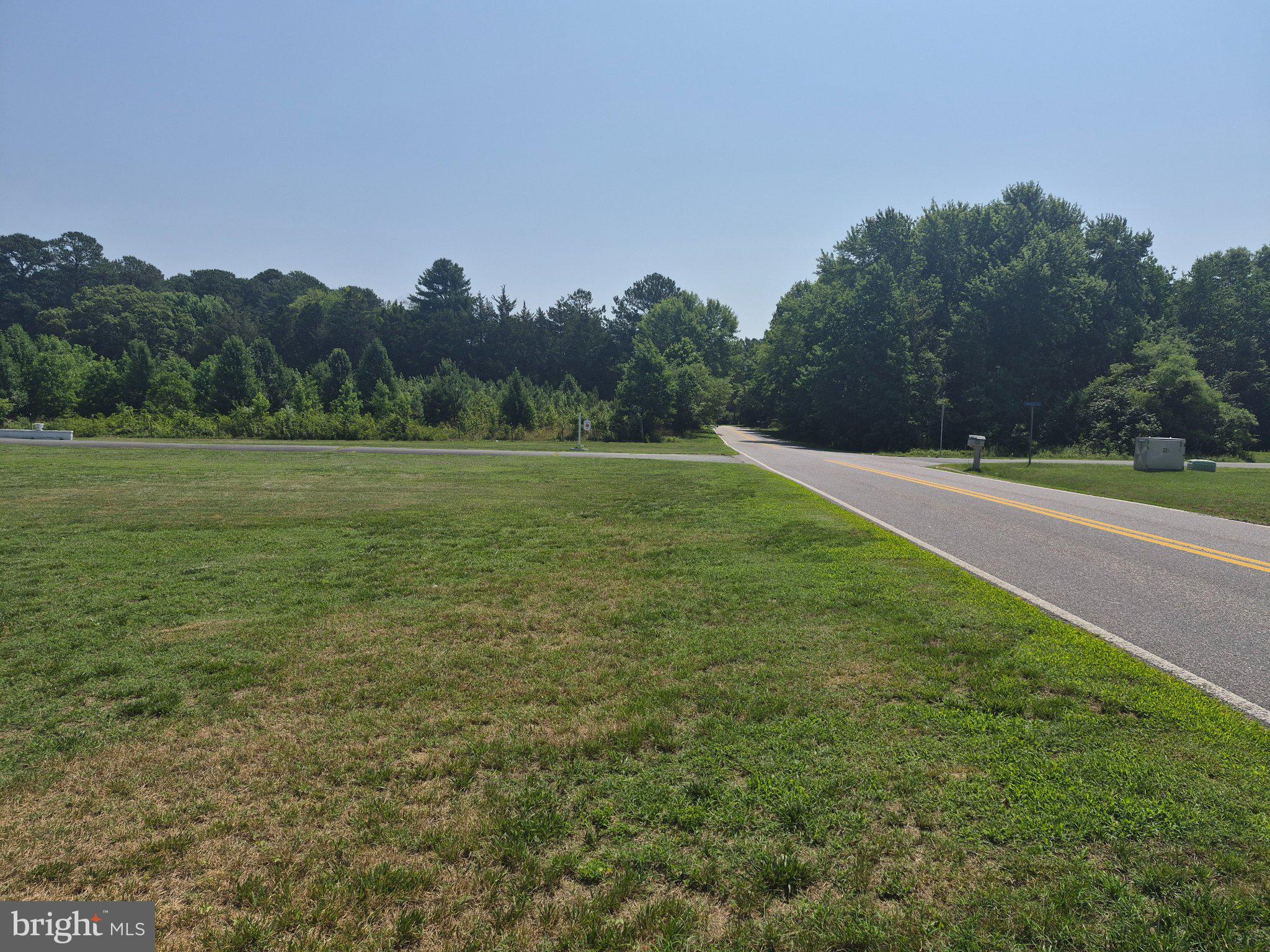 1043 Camp Road Denton, MD 21629 - Photo 17 of 17 Serene landscape meets open road.