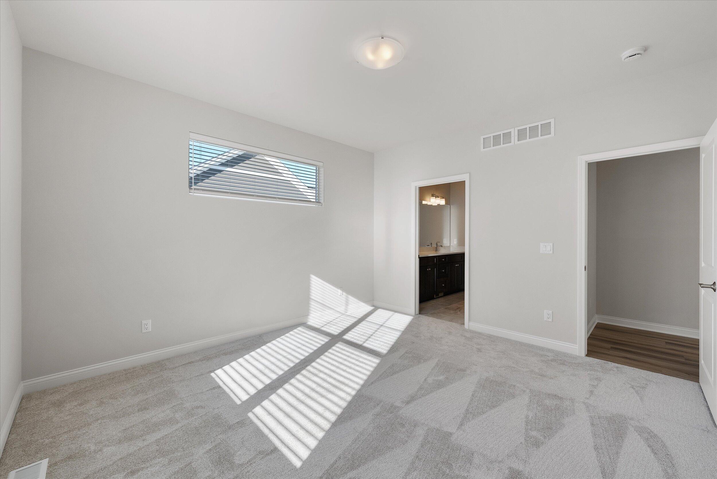 394 Sandy Circle Pewaukee, WI 53072 - Photo 19 of 36 Primary Bedroom