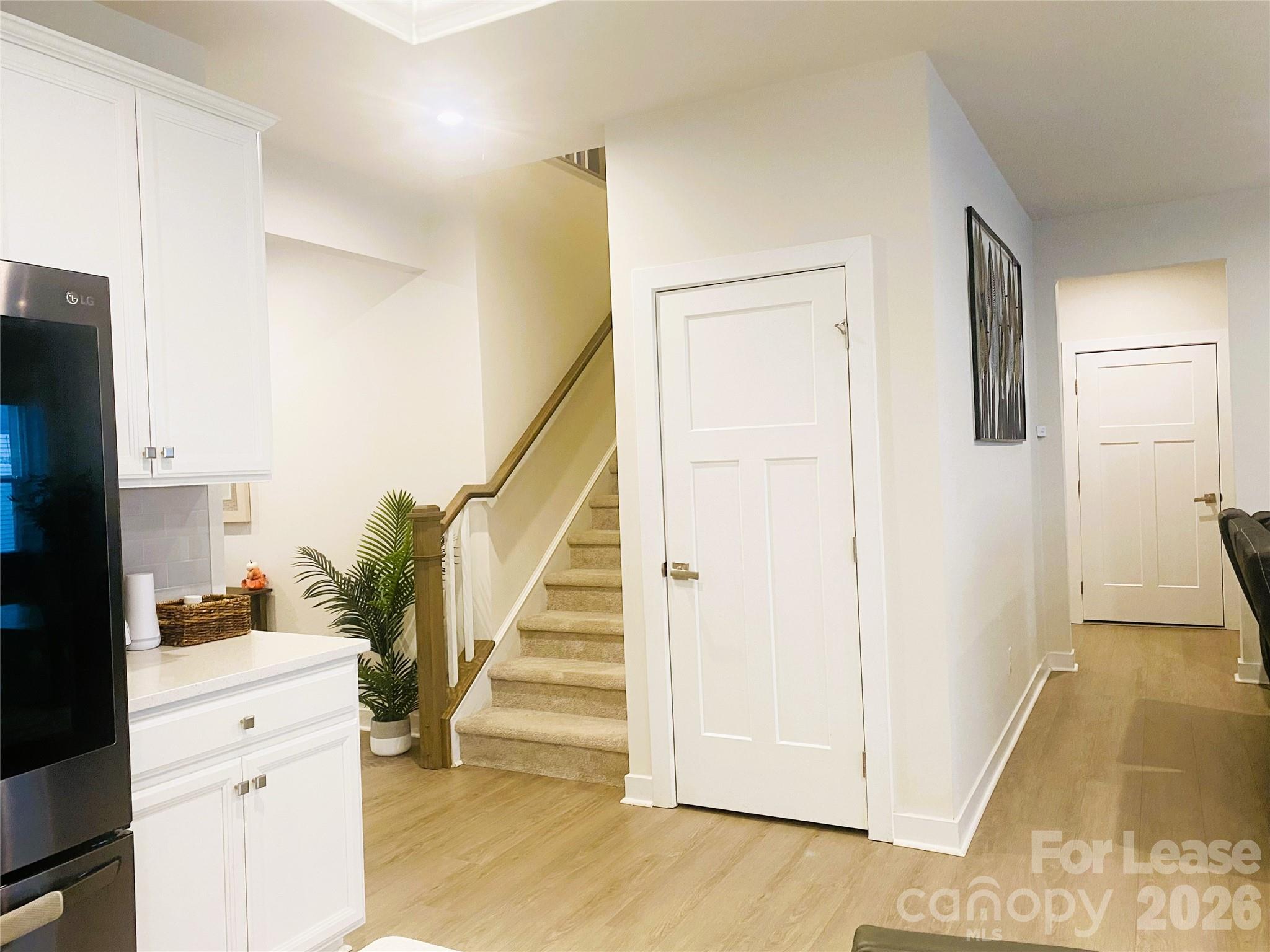 3163 Streamside Drive Davidson, NC 28036 - Photo 6 of 20 a view of entryway with furniture and wooden floor