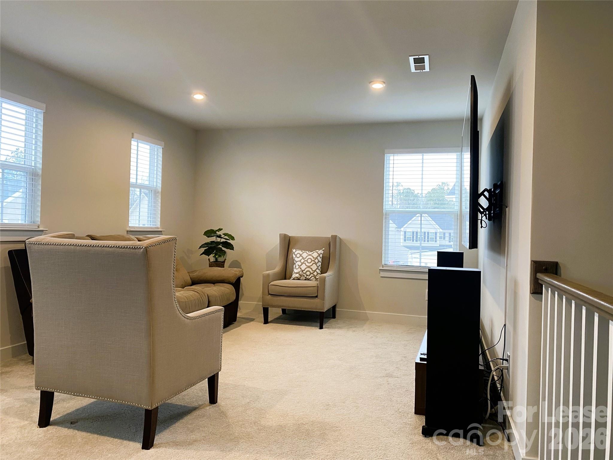 3163 Streamside Drive Davidson, NC 28036 - Photo 10 of 20 a living room with furniture and a window