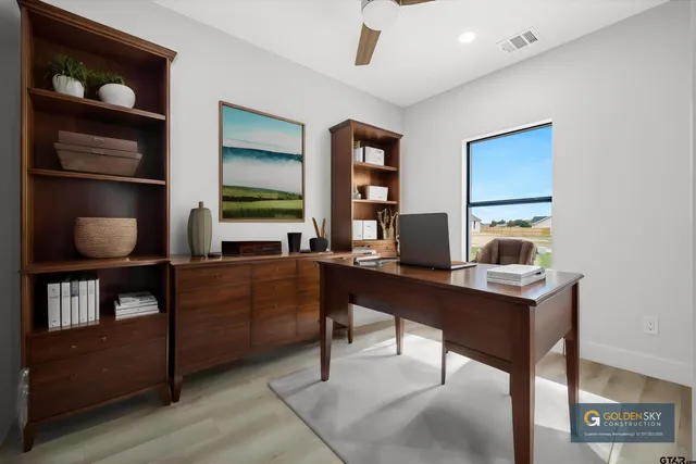 a room with furniture window and book shelf