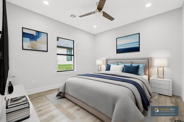 a bedroom with bed and a window