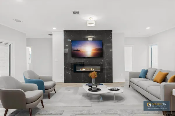 a living room with furniture and a flat screen tv