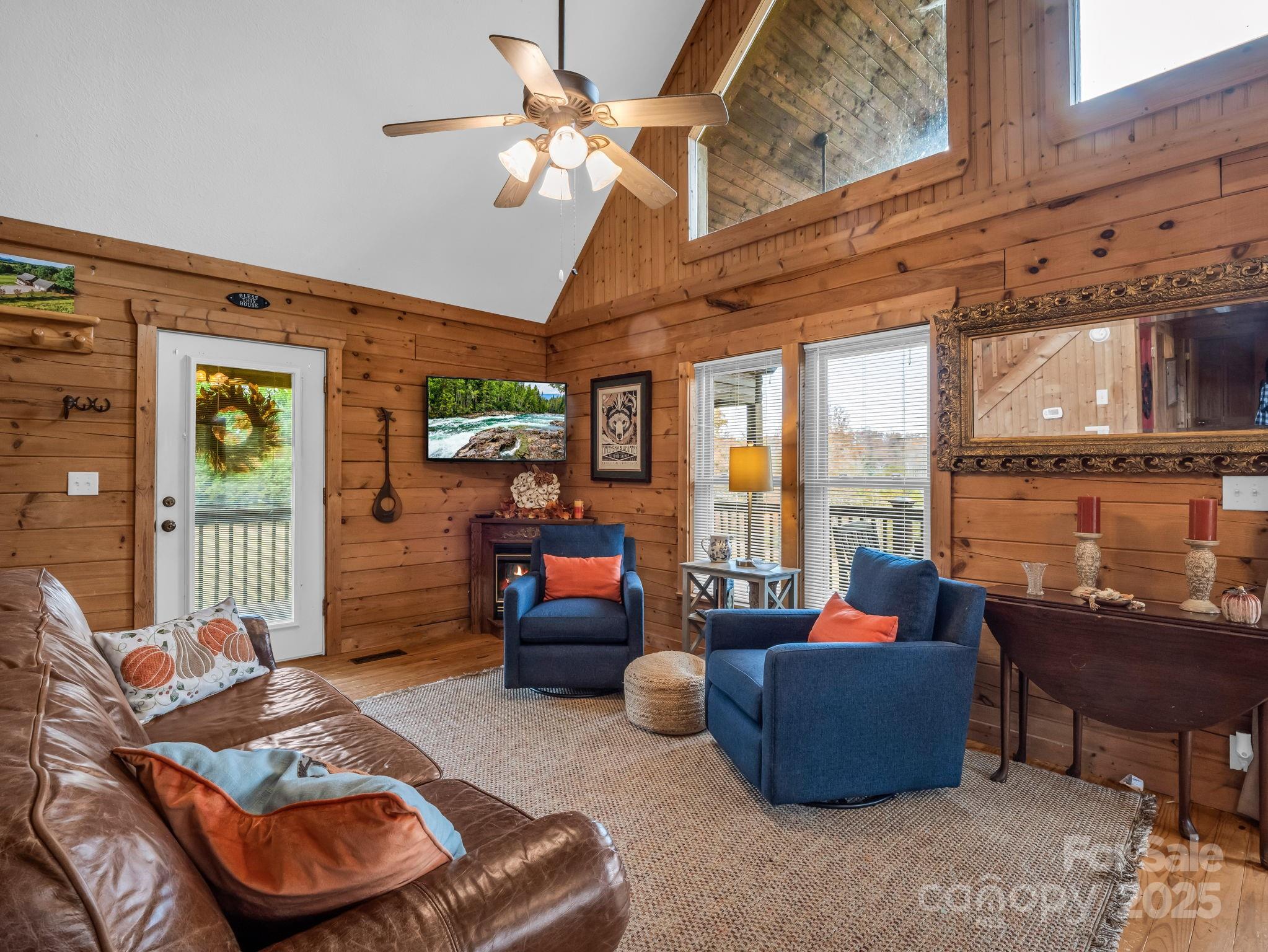 557 Emerald Parkway Rutherfordton, NC 28139 - Photo 11 of 48 a living room with furniture and a floor to ceiling window
