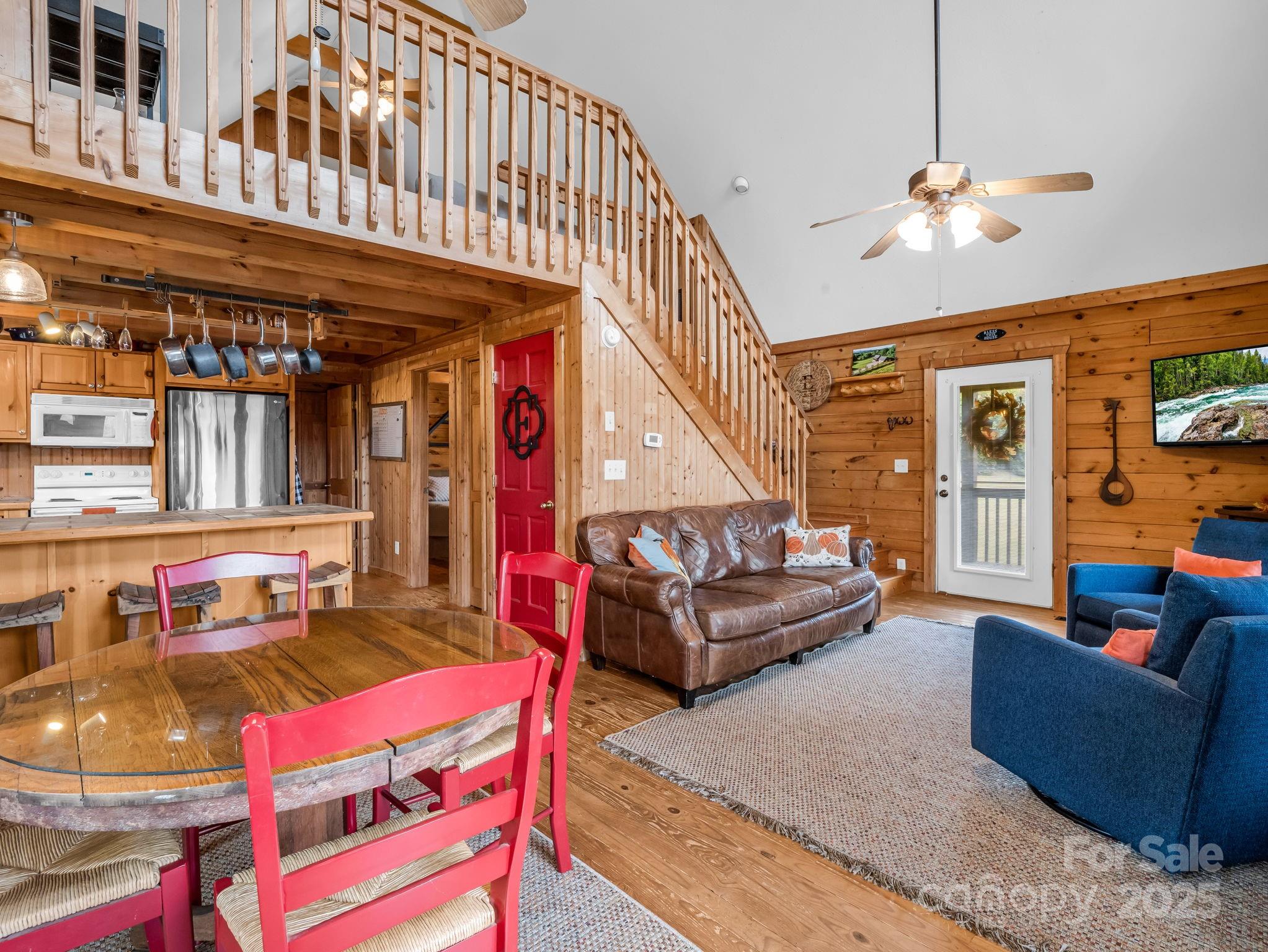 557 Emerald Parkway Rutherfordton, NC 28139 - Photo 12 of 48 a living room with furniture and a chandelier