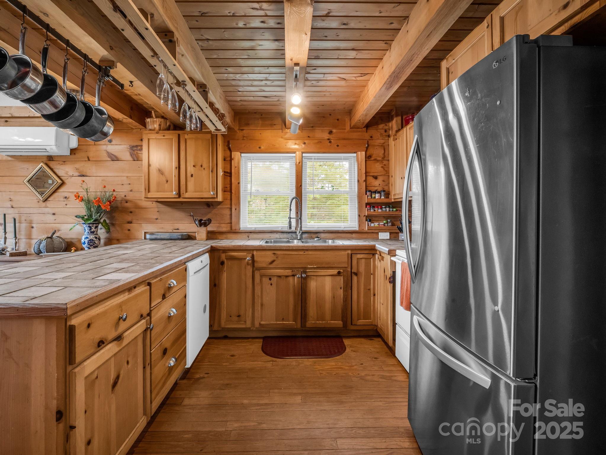 557 Emerald Parkway Rutherfordton, NC 28139 - Photo 16 of 48 a kitchen with stainless steel appliances granite countertop a stove a sink and a refrigerator