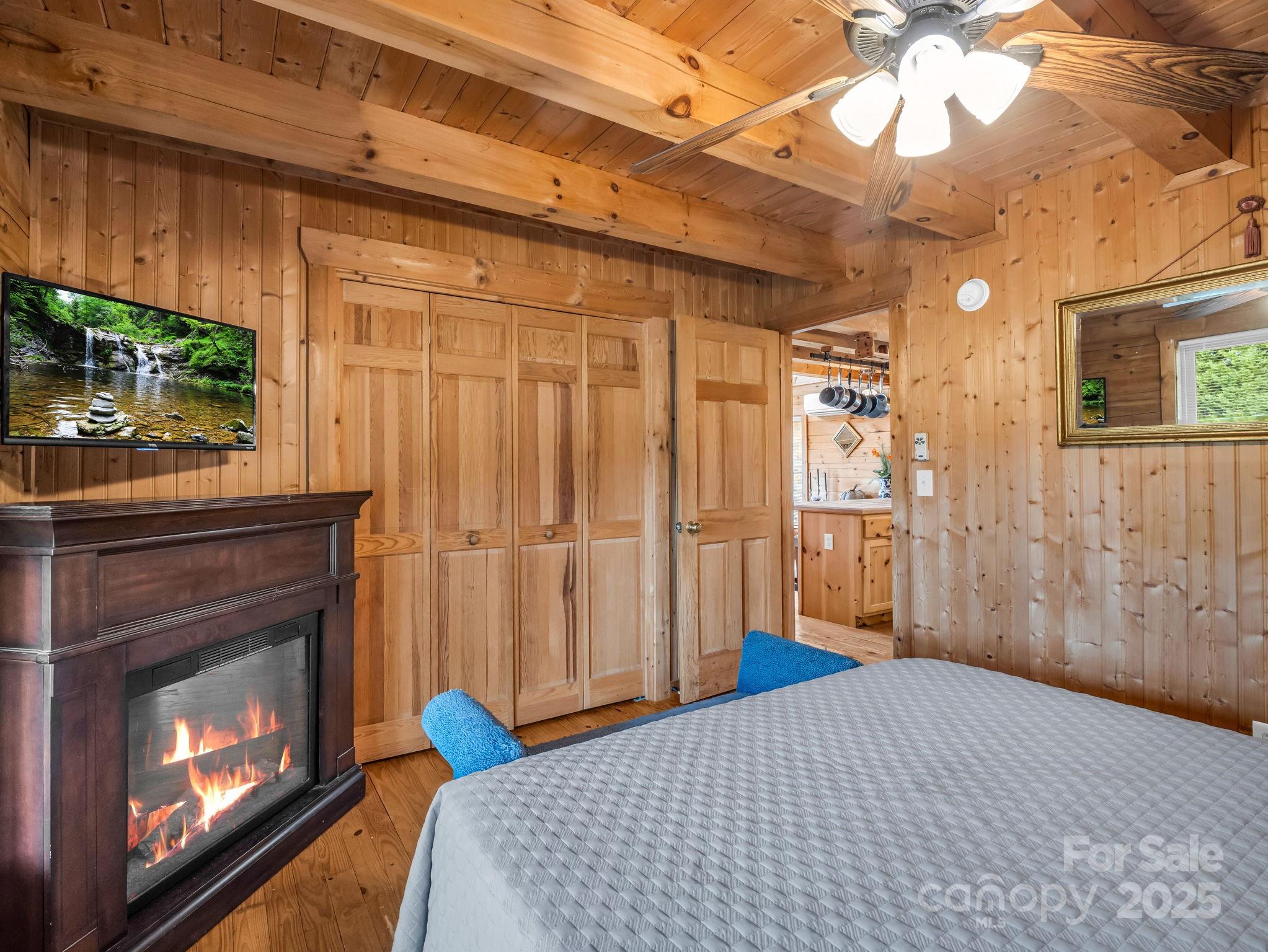 557 Emerald Parkway Rutherfordton, NC 28139 - Photo 20 of 48 a bedroom with a bed and a fireplace