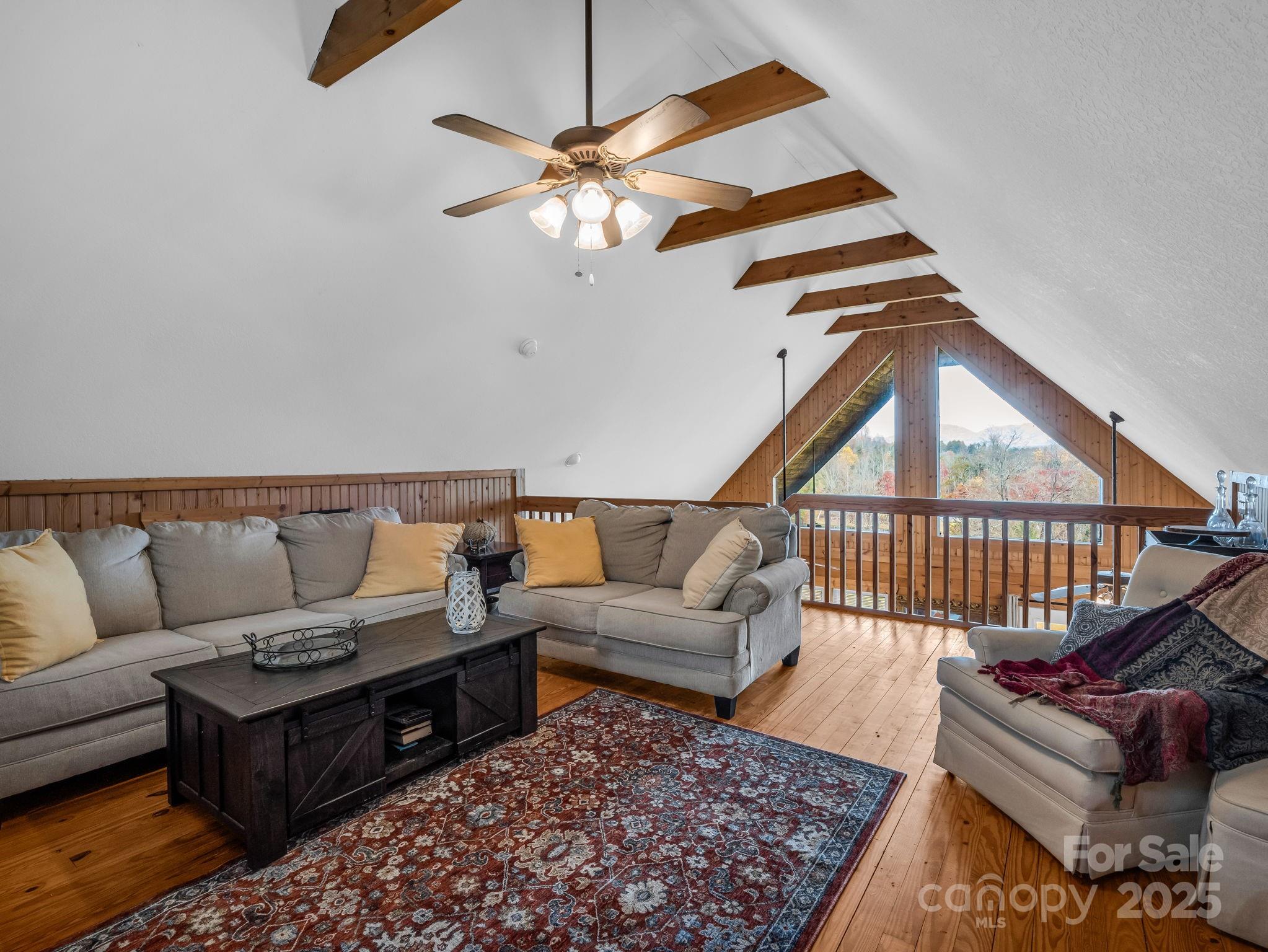 557 Emerald Parkway Rutherfordton, NC 28139 - Photo 23 of 48 a living room with furniture and a rug