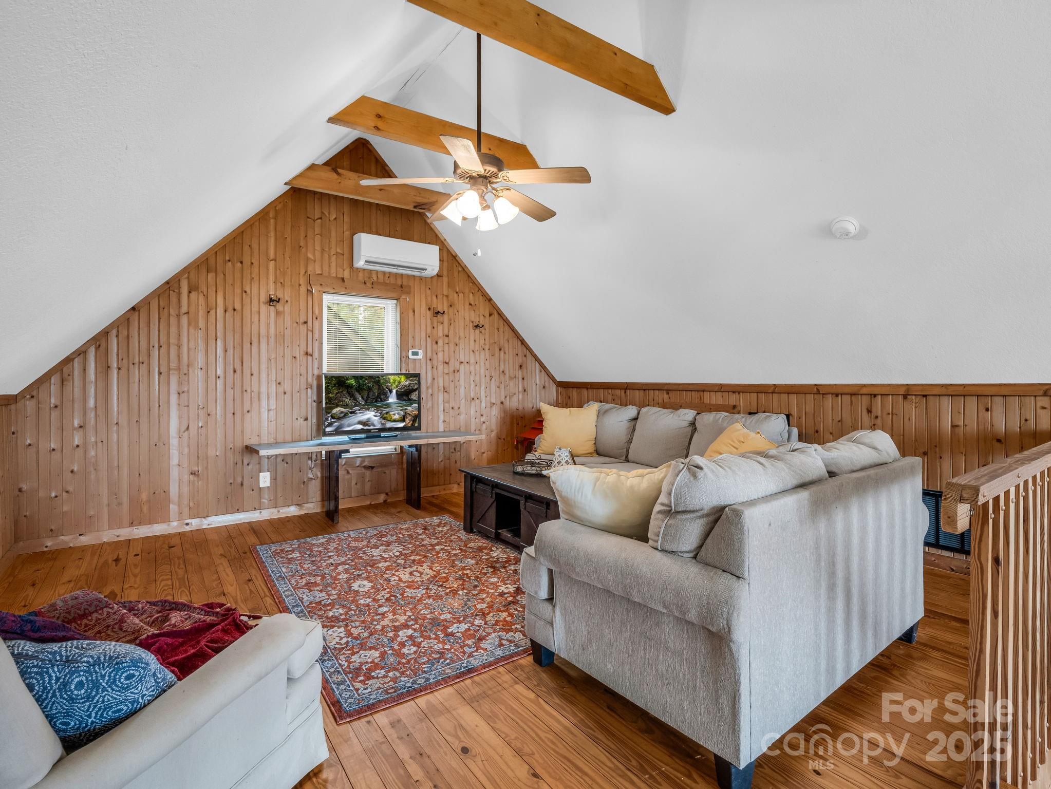 557 Emerald Parkway Rutherfordton, NC 28139 - Photo 25 of 48 a living room with furniture and a rug